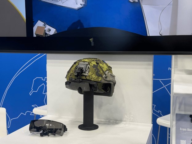 The Vegvisir VISOR display and a helmet fitted with a mounted display on an exhibition stand