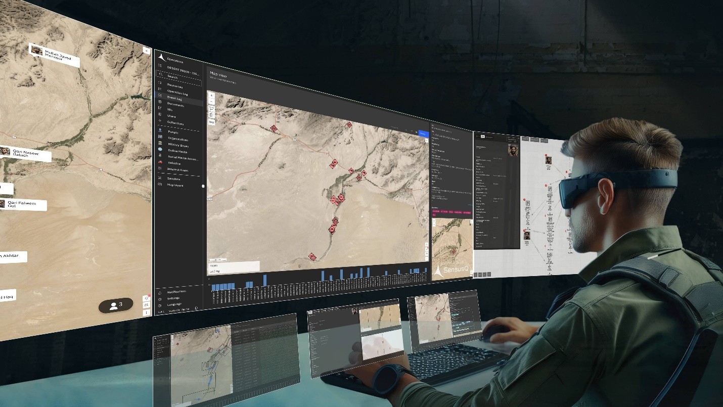 An operator wearing mixed-reality goggles works with virtual map and data screens in the Virtual Command Station